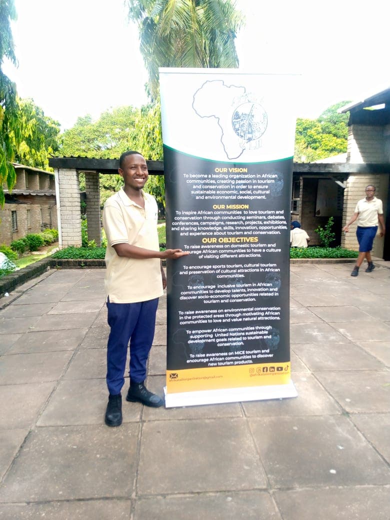 Member presenting Afrika Talii banner