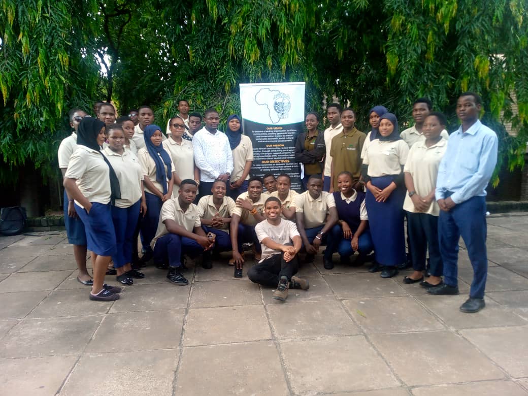 School outreach with Afrika Talii banner